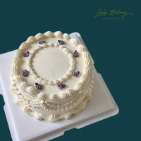 White Vintage with Purple Rosette Cake