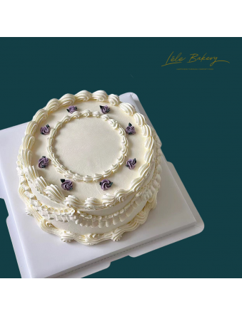 White Vintage with Purple Rosette Cake