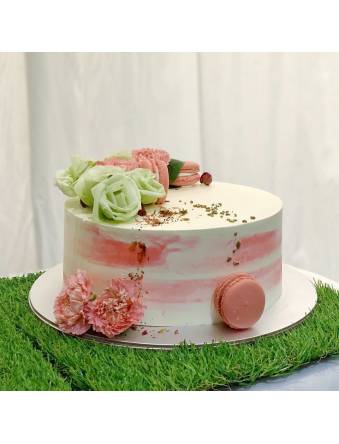 Pink and White Floral and Macarons Cake